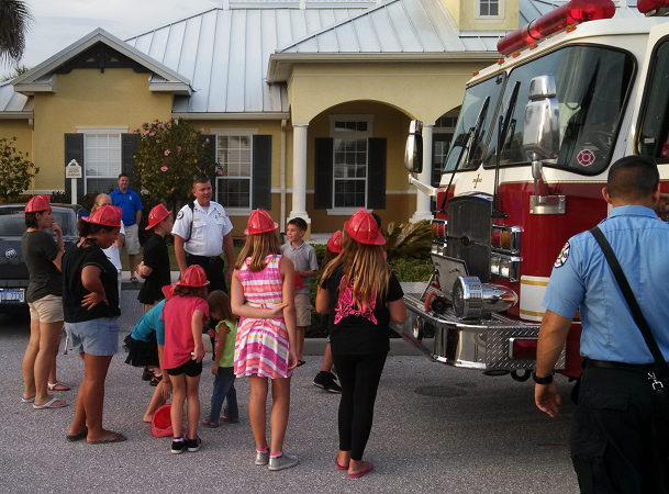 group of kids looking at a fire engine